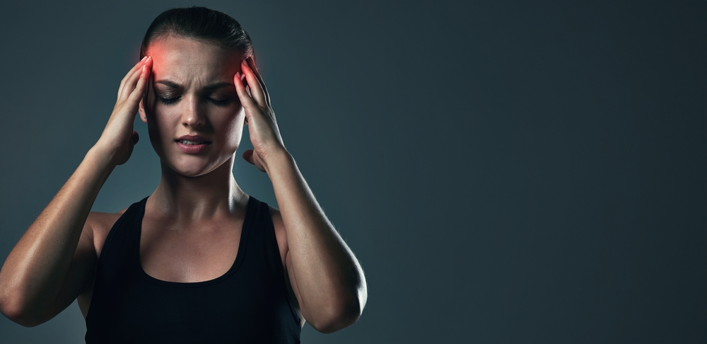 Woman, headache and burnout on exercise